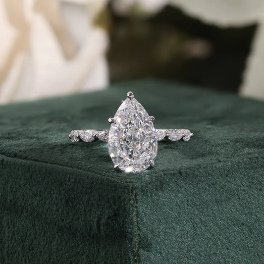 Pear Cut Lab Grown Diamond Hidden Halo Engagement Ring with Marquise Station Band