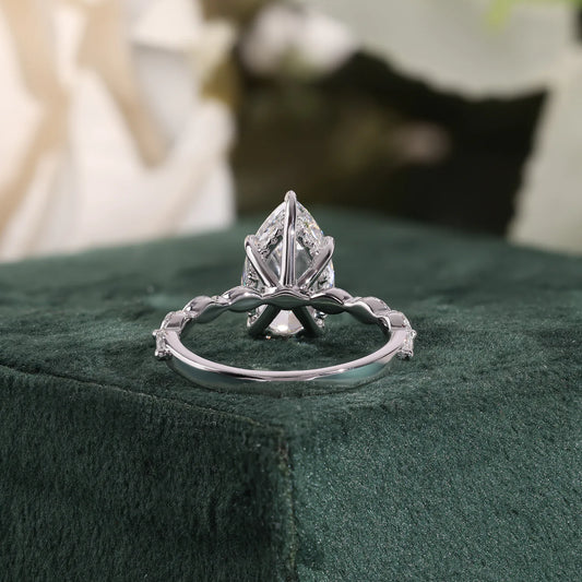 Pear Cut Lab Grown Diamond Hidden Halo Engagement Ring with Marquise Station Band