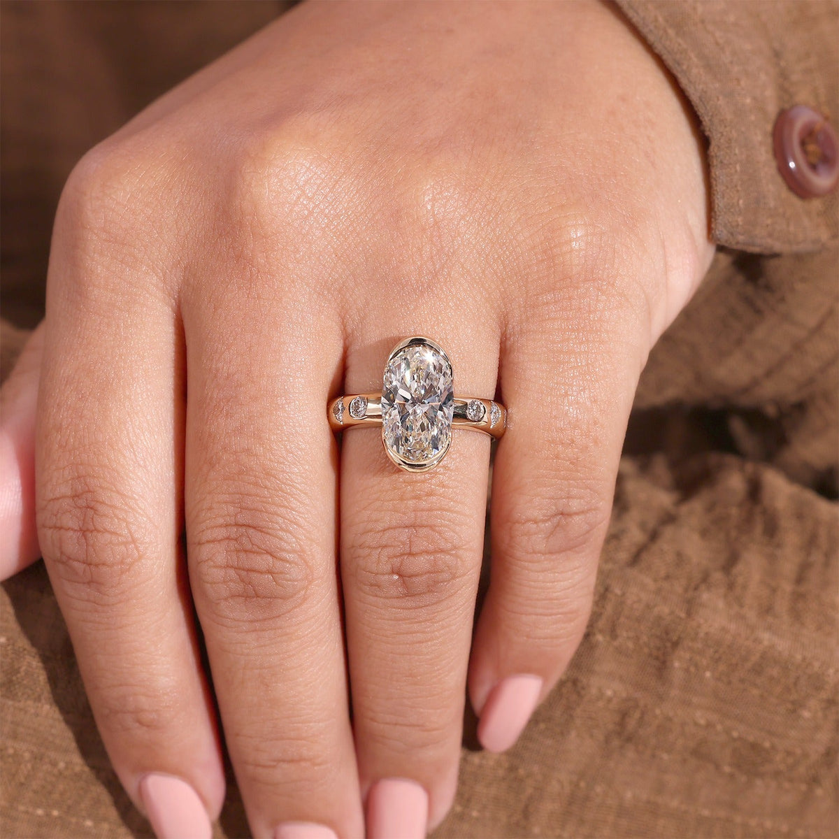 Bezel Set Oval Diamond Ring with Scattered Ring and Hidden Accent